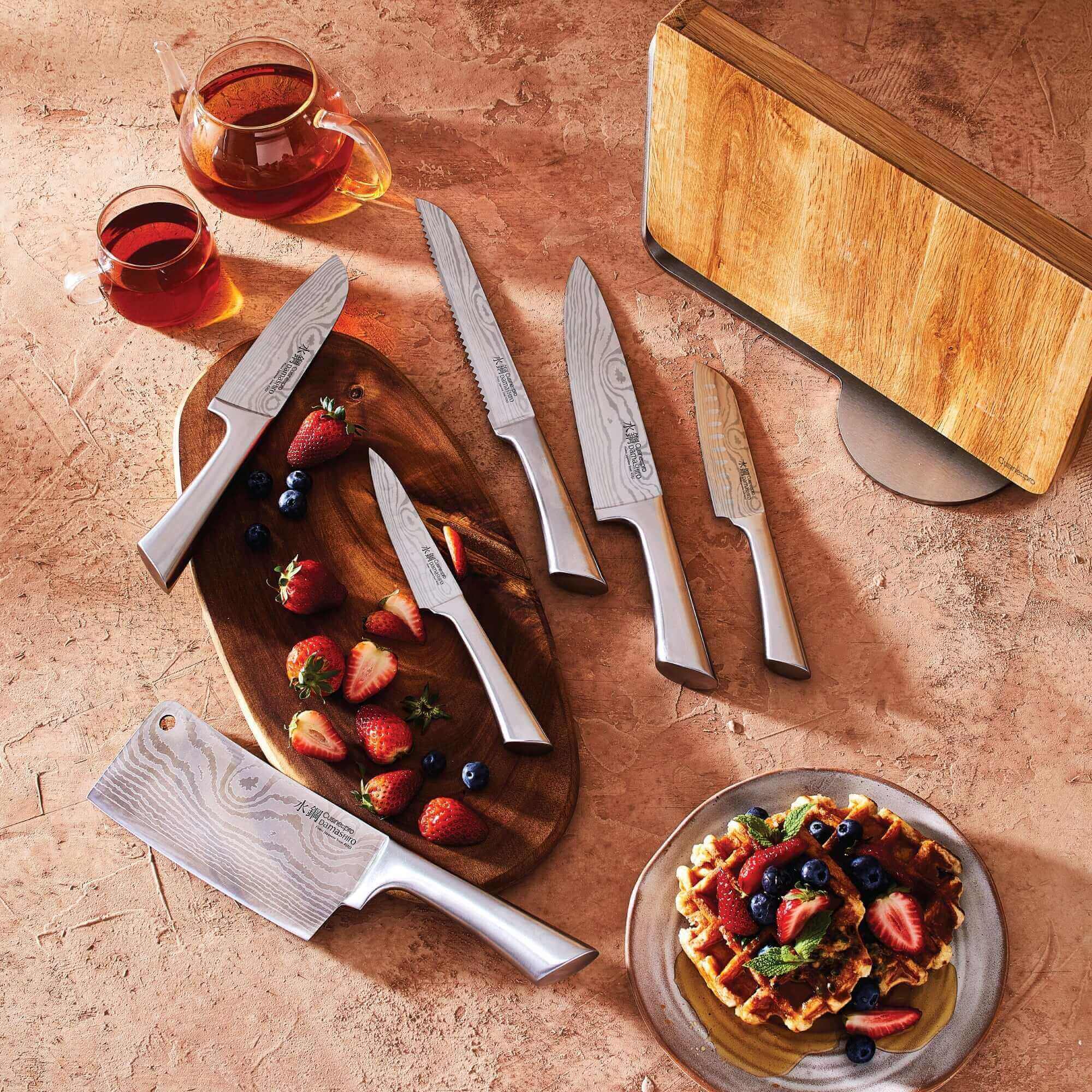 Cuisine::pro® Damashiro® Meiyo Knife Block 7-piece set with superior quality Japanese knives on display with fruits and breakfast waffles.