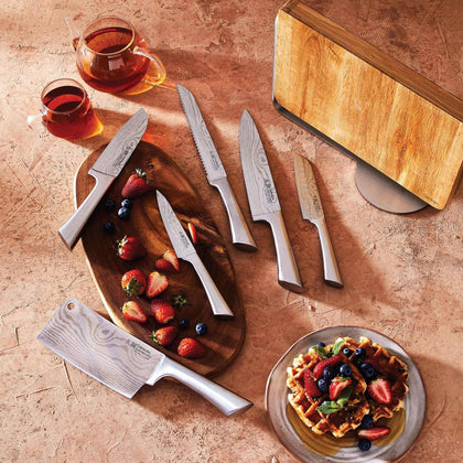 Cuisine::pro® Damashiro® Meiyo Knife Block 7-piece set with superior quality Japanese knives on display with fruits and breakfast waffles.