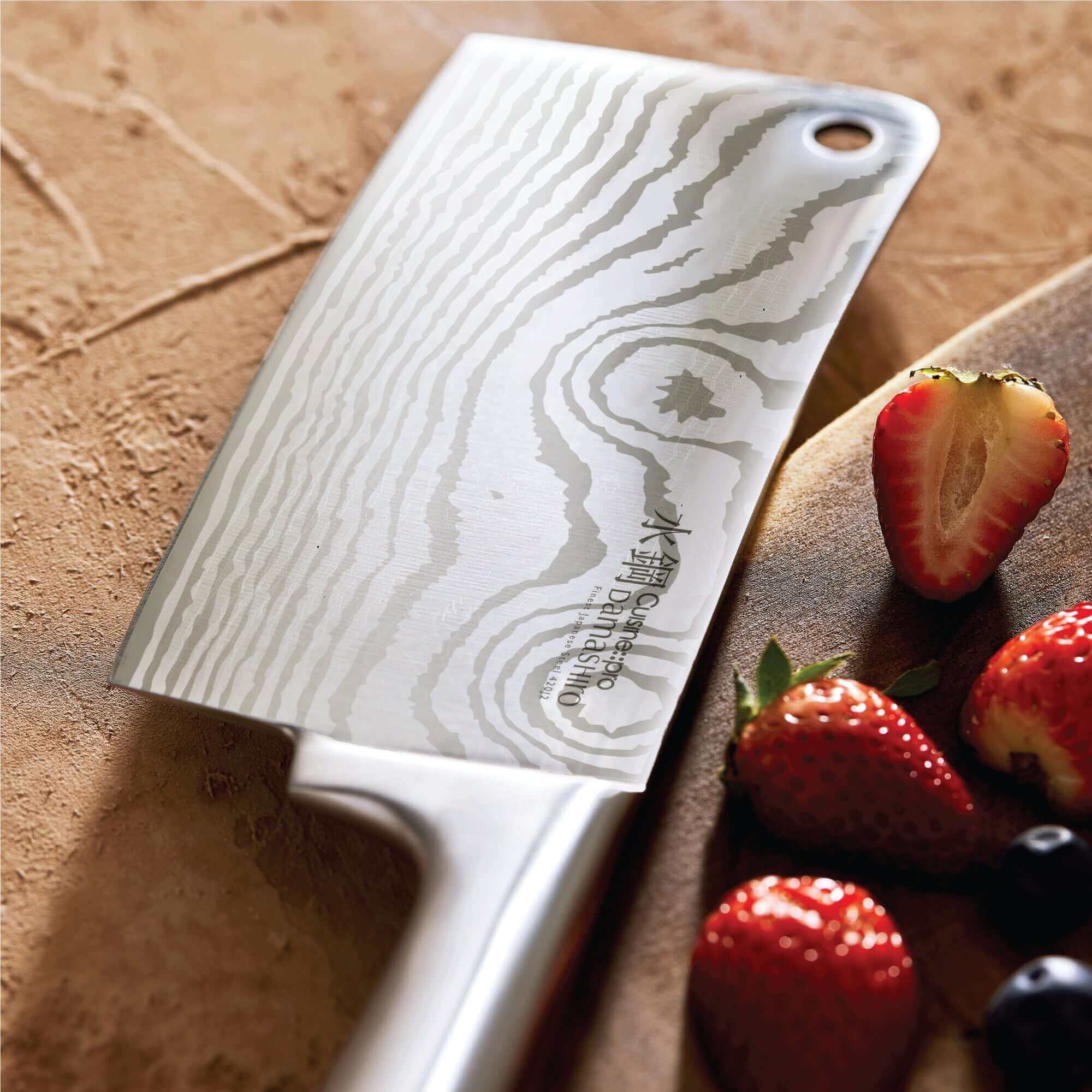 Cuisine::pro® Damashiro® Meiyo Knife with Japanese Steel Blade on Wooden Surface with Strawberries and Berries