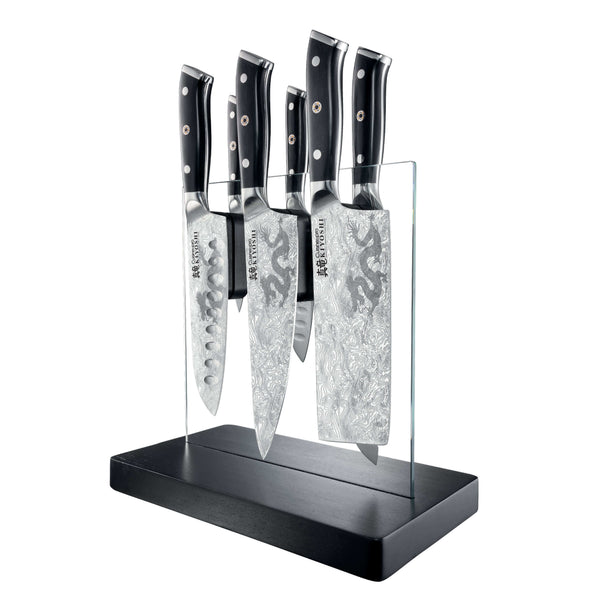 Black-handled knives in a Cuisine pro KIYOSHI Kiyo 7 Piece Knife Block displayed on a black stand with transparent holders.